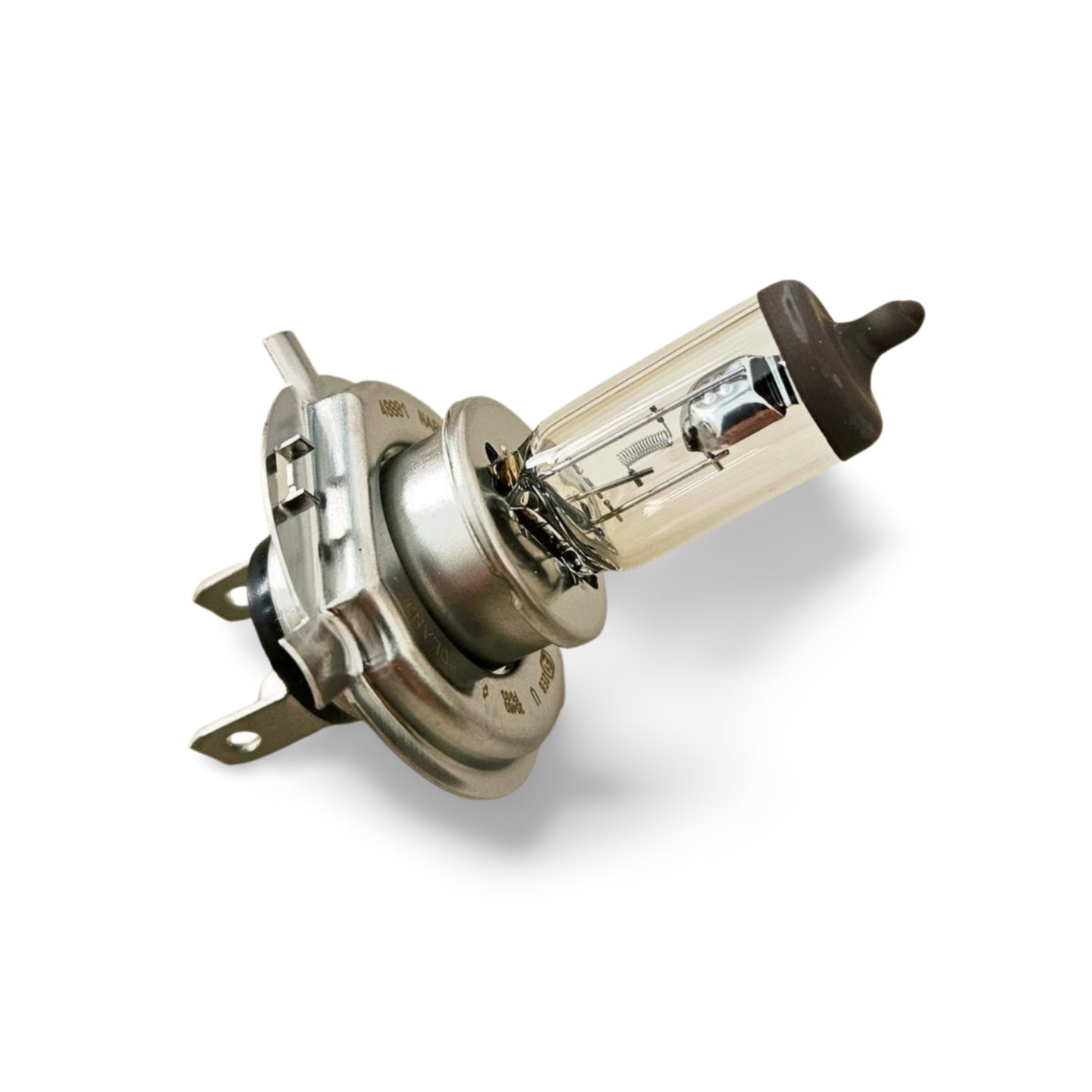Lampada alogena H4 12V 60/55W per fari Citroën 2CV, Dyane, Mehari, CX e Visa posata su un piano chiaro.
