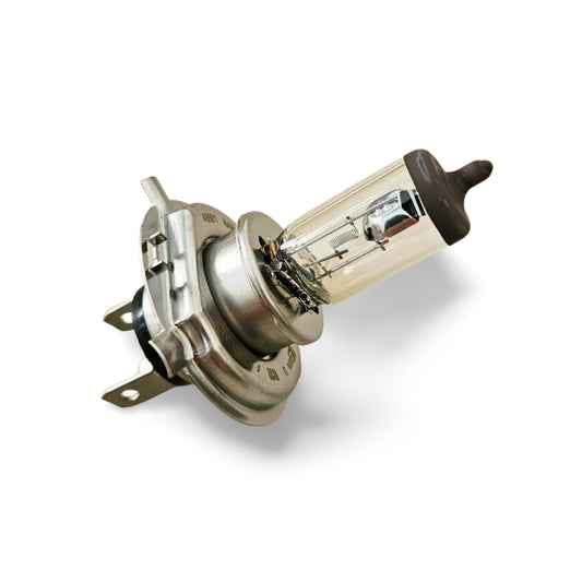 Lampada alogena H4 12V 60/55W per fari Citroën 2CV, Dyane, Mehari, CX e Visa posata su un piano chiaro.